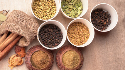 Collection of indian Spices and herbs. Food and cuisine ingredients on wooden background.