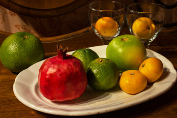 Delicious fruit platter pomegranate papaya oranges passion fruits berries 
