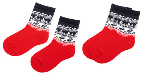 Pair of blue red nordic socks with deer and snowflake geometric ornament isolated on a white background