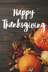 Happy Thanksgiving Card. Happy thanksgiving text on pumpkins, autumn leaves, anise, berries, acorns...