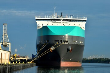 Cargo Freighter ship moored at river port Savannah, Georgia, USA.