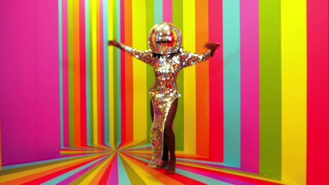 Cinematic footage of a woman dancing inside a box room