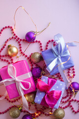 pink Christmas mood. Gifts and presents with bow. New Year