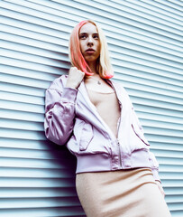 young pretty fashion dressed blong teenage girl posing friendly, lifestyle people concept