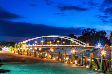 The light Bridge over the Nan River (Wat Phra Si Rattana Mahathat also - Chan Palace) New Landmark It is a major tourist is Public places attraction Phitsanulok,Thailand.Twilight dramatic sunset sky