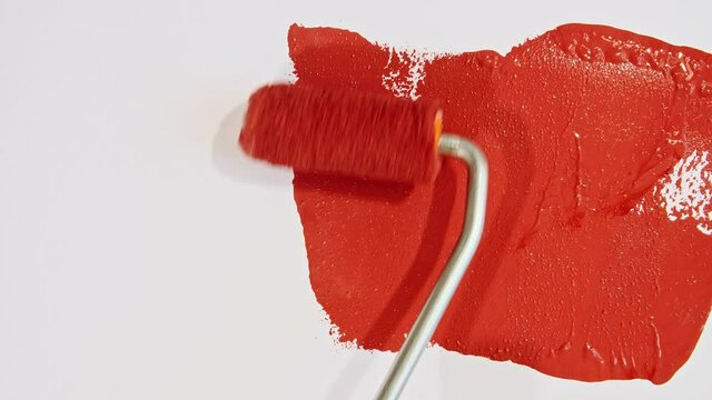 Abstract brushstrokes of red paint brush applied isolated on a white background. Red paint smear texture. Red sparkling textured artistic illustration. Smears of cosmetics. High quality 4k footage