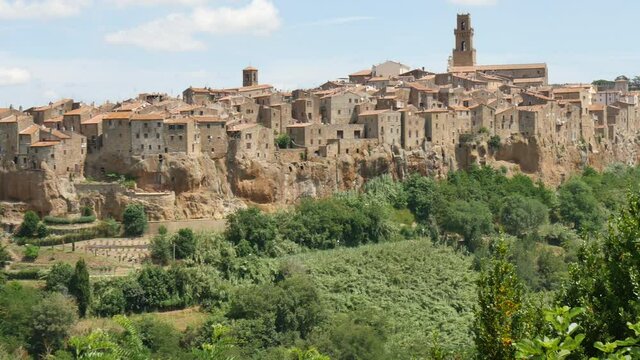 Pitigliano, Grosseto, Tuscany, Italy JULY, 13, 2016 Pitigliano old town in Tuscany, Italy inhabited in Etruscan times with medieval and renaissance monuments. Panoramic lef to right view in a sunny