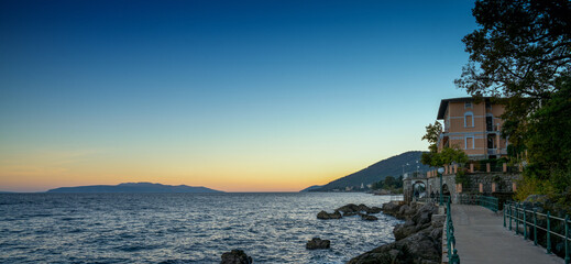 boardwalk along the Adriatic seashore in northern Croatia near Opatja at sunset