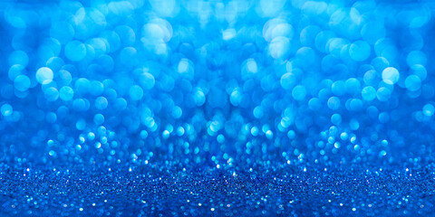 Blue sparkle background with bokeh.