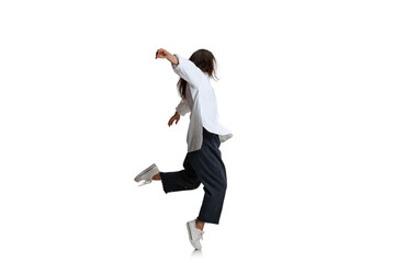 One pretty woman in casual wear dancing isolated on white background. Art, motion, action, flexibility, inspiration concept.