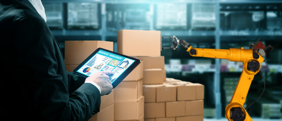 Smart robot arm systems for innovative warehouse and factory digital technology . Automation manufacturing robot controlled by industry engineering using IOT software connected to internet network .