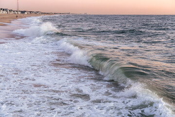 Waves breaking onto the beach at Sunrise