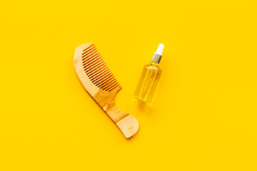 Herbal hair oil for treatment with wooden hair comb