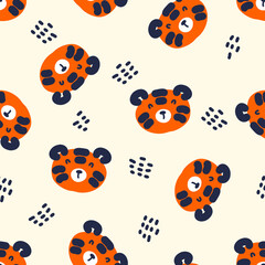 Naklejka premium Hand drawn seamless pattern with tiger faces and dots. Perfect for T-shirt, textile and print. Doodle vector illustration for decor and design. 