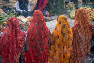 Traditional chhath pooja performed along the river side by man and women by offering the fruit and...