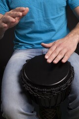 Man Playing the African Djembe Drum