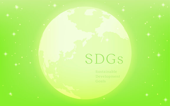 SDGs、光る地球とSDGsの文字、キラキラ星の輝く緑背景のエコイメージ