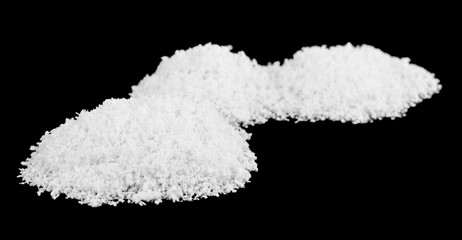 A pile of white snow isolated on a black background.