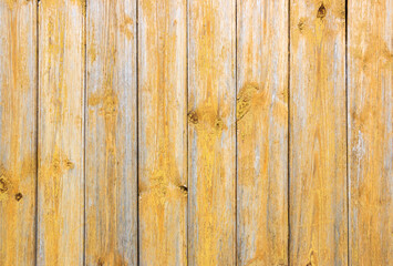 Old grey and yellow wooden background with cracks and scratches in vintage style