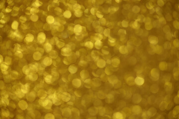 Gold sparkle blurry background with dots texture blurred 