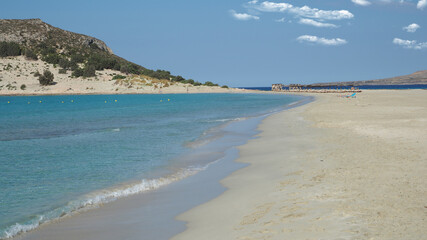 Beautiful sandy beach of Simos with crystal clear turquoise sea and natural sand dunes, Elafonisos island, Peloponnese, Greece