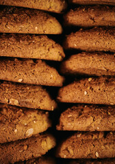 Pile of oat cookies on wooden table, close-up, selective focus