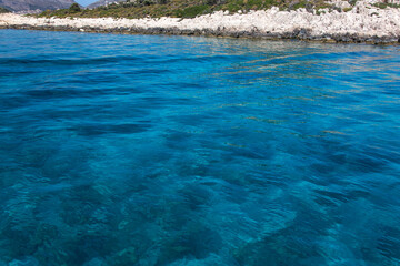 Beautiful Turquoise waters of the Mediterranean sea near the coast of Kas, Antalya, Turkey.