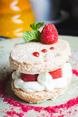 Traditional sweet cakes with three layers of airy dough with whipped cream and berries.