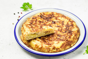 Spanish tortilla on light background. Space for text.