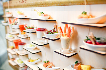 Luxury food and drinks on wedding table. Shallow DOF