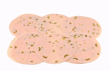 Slices of turkey ham with olive pieces on white background 