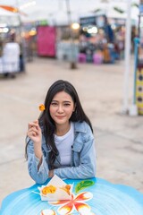 Asian woman shopping in a random night market in Bangkok, Thailand
