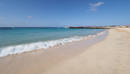 Beach with pier on Atlantic Ocean at Sal island, Cape Verde