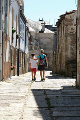 Mother and son sightseeing in a small Spanish village