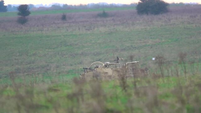 British army Supacat Jackal (MWMIK) rapid assault, fire support and reconnaissance vehicle in action on a military exercise, Salisbury Plain Wiltshire UK