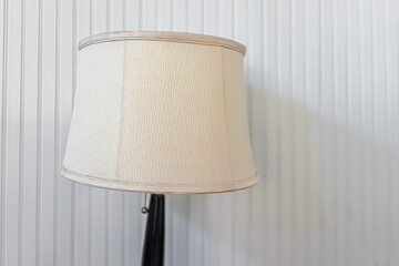 Vintage cottage style white wall in house home French country design and closeup of lamp in living...