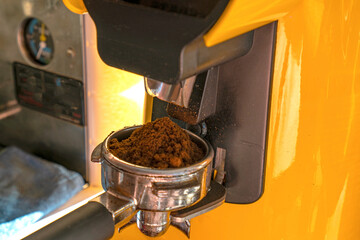 barista is grinding the coffee beans 