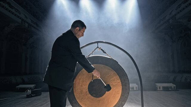 Big gong. Musician plays a concert