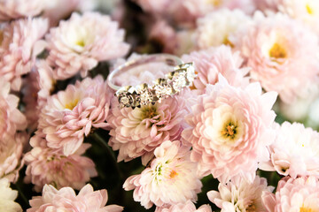 Elegant diamond ring with pink daisy flower background
