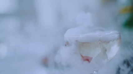 Steaming champagne in a glass due to dry ice - Powered by Adobe