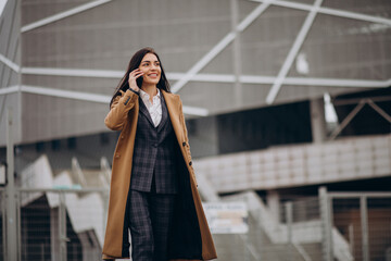 Fototapeta premium Young business woman using phone