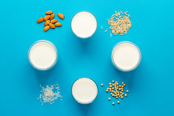 Dairy free substitute milk with nuts and cereals, top view