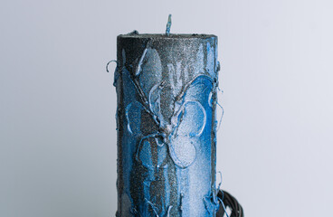 blue candle on a wooden background