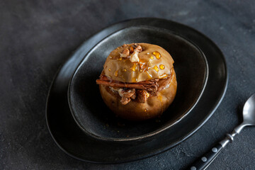 Baked apples with cinnamon stuffed with walnuts