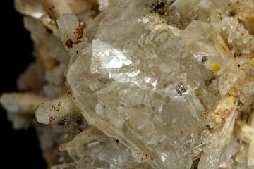 Macro mineral stone fluorite with quartz against black background