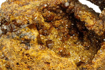 Macro mineral stone Garnet, Green Garnet, Epidote Grossular in the rock on a white background