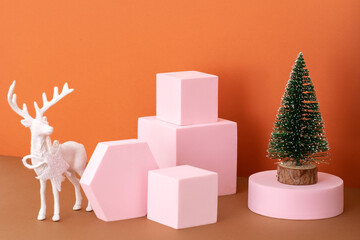 Christmas toy deer and mock up podiums on brown background. Modern Christmas still life concept 