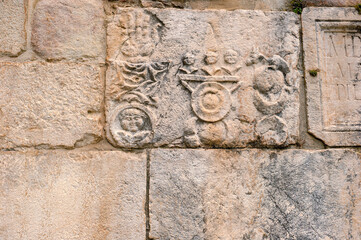 romanesque marble bas-reliefs on the walls of the abbey of goleto- avellino campania,italy.