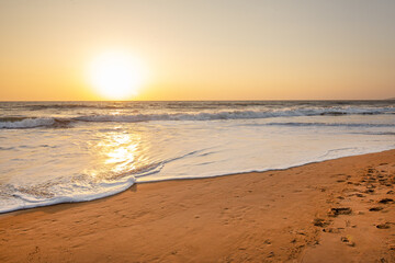 Fototapeta na wymiar Sunrise- paradise picture in yellow colors in indian Goa!