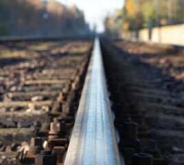 view of the rails from a low perspective, close-up of the rails and railway sleepers.